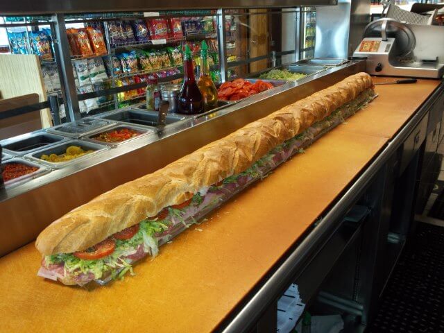 A Sorrento's famous six-foot Italian party sub, sliced and ready to serve